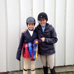 Mia Bonacorsi and Megan Martin with Mia's champion ribbon from her short stirrups debut